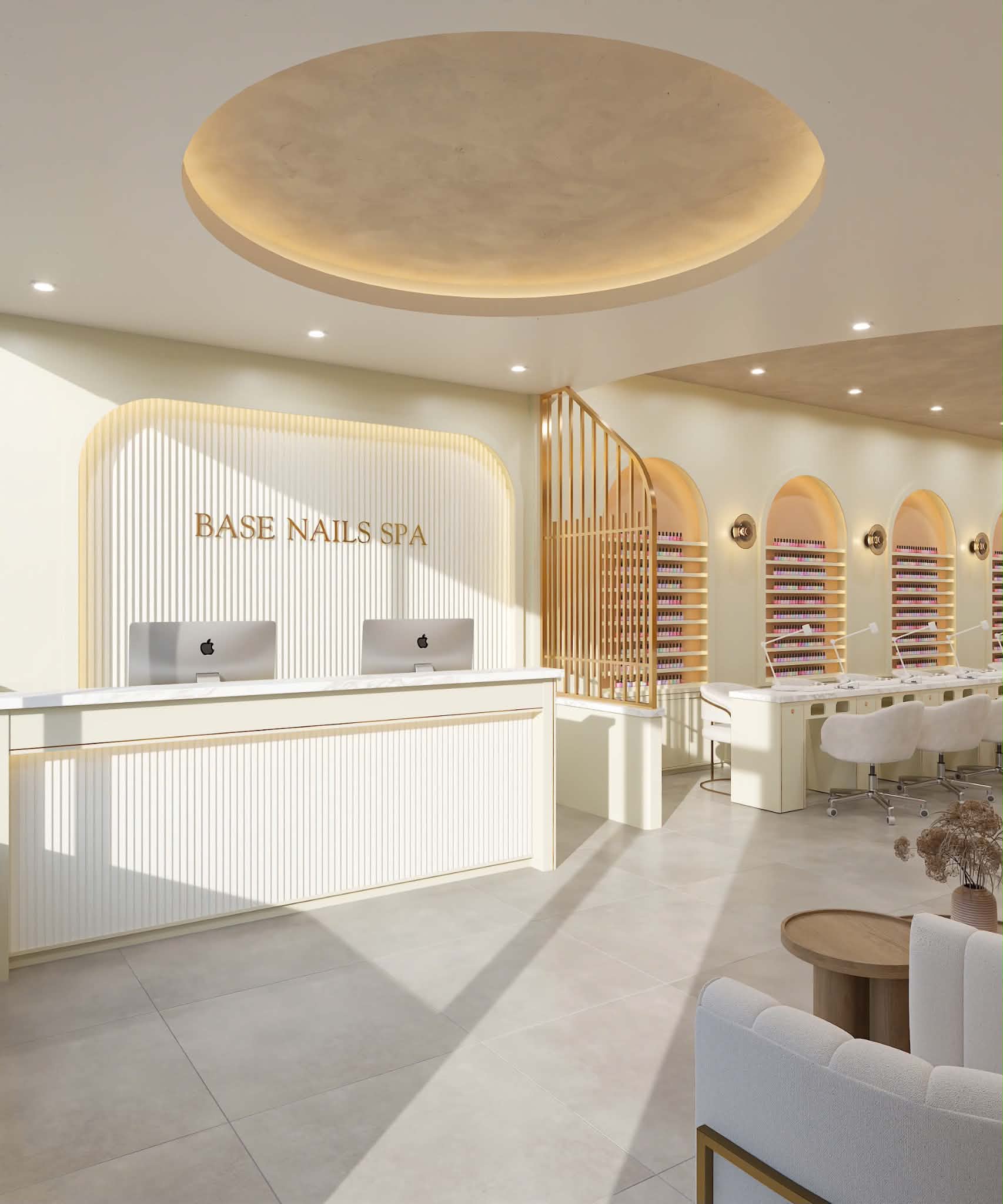 Cream and gold nail salon interior with a reception desk and manicure stations